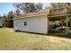White detached garage with a wooden deck and fenced yard at 1746 Pierpont Ave, Charleston, SC 29414