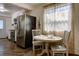 Bright kitchen nook with a round table and two chairs near a window at 1746 Pierpont Ave, Charleston, SC 29414