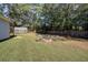 Spacious backyard with fire pit, shed, and wooden fence at 1746 Pierpont Ave, Charleston, SC 29414
