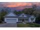 White house with a front porch and yard at sunset at 1746 Pierpont Ave, Charleston, SC 29414