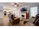 Spacious living room with kitchen view, fireplace, and recessed lighting at 1746 Pierpont Ave, Charleston, SC 29414