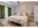 Spacious bedroom with a king-size bed, and a large window with green curtains at 1746 Pierpont Ave, Charleston, SC 29414