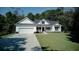 White house with a two-car garage and landscaped lawn at 1746 Pierpont Ave, Charleston, SC 29414
