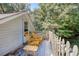 Relaxing deck with rocking chairs and a view of the woods at 1746 Pierpont Ave, Charleston, SC 29414