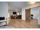 Open living room featuring hardwood floors and a cozy fireplace at 1746 Pierpont Ave, Charleston, SC 29414