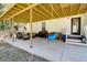 Covered patio with seating area, grill, and a swing at 1746 Pierpont Ave, Charleston, SC 29414