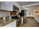 Modern kitchen with stainless steel appliances and wood-look countertops at 1746 Pierpont Ave, Charleston, SC 29414