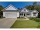 Two-story home with a white exterior, black shutters, and a porch at 1746 Pierpont Ave, Charleston, SC 29414