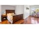 Small bedroom with wooden bed frame and adjacent workspace at 3906 Heron Marsh Cir, Johns Island, SC 29455