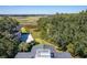 High-angle view of a house with water access and marsh views at 3906 Heron Marsh Cir, Johns Island, SC 29455