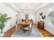 Elegant dining room with hardwood floors, a chandelier, and a wooden table at 3906 Heron Marsh Cir, Johns Island, SC 29455