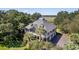 Aerial view of house, lush landscaping, and marsh views at 3906 Heron Marsh Cir, Johns Island, SC 29455