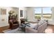 Living room with water views, hardwood floors, and comfortable seating at 3906 Heron Marsh Cir, Johns Island, SC 29455