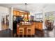 Modern kitchen with granite island, stainless steel appliances, and wood cabinets at 3906 Heron Marsh Cir, Johns Island, SC 29455