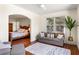 Sitting area with sofa and rug, adjacent to the main bedroom at 3906 Heron Marsh Cir, Johns Island, SC 29455