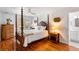 Bedroom with hardwood floors and a wooden four poster bed at 3906 Heron Marsh Cir, Johns Island, SC 29455