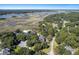 Aerial view of neighborhood with marsh and water views at 3906 Heron Marsh Cir, Johns Island, SC 29455