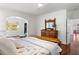 Main bedroom with wooden bed frame and dresser, access to other rooms at 3906 Heron Marsh Cir, Johns Island, SC 29455