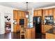 Updated kitchen with granite countertops, wood cabinets, and breakfast bar at 3906 Heron Marsh Cir, Johns Island, SC 29455