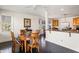 Bright breakfast nook with wood table and chairs near kitchen at 3906 Heron Marsh Cir, Johns Island, SC 29455