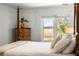 Main bedroom with water views and a wooden four poster bed at 3906 Heron Marsh Cir, Johns Island, SC 29455