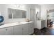 Bathroom with double vanity, marble countertop, and dark tile floor at 3906 Heron Marsh Cir, Johns Island, SC 29455