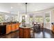 Kitchen with island, granite countertops, and wood cabinets at 3906 Heron Marsh Cir, Johns Island, SC 29455