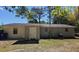 Rear view of a house with grey and white siding at 5738 Scott White Rd, Hollywood, SC 29449