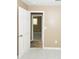 Open doorway shows bedroom with wood floor at 5738 Scott White Rd, Hollywood, SC 29449