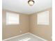 Bedroom with grey carpet and two windows at 5738 Scott White Rd, Hollywood, SC 29449