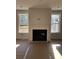 Living room featuring a modern fireplace and large windows at 306 Mizell Rd, Dorchester, SC 29437