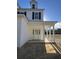 Front entrance of two story house with white columns and porch at 310 Mizell Rd, Dorchester, SC 29437