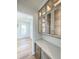 Butlers pantry with gray cabinets, quartz countertops, and wine cooler at 1467 Jeremy Cay Ct, Awendaw, SC 29429