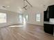 Large bedroom with hardwood floors, high ceilings, and multiple windows at 1467 Jeremy Cay Ct, Awendaw, SC 29429