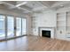 Spacious living area with hardwood floors, fireplace, and access to deck at 1467 Jeremy Cay Ct, Awendaw, SC 29429