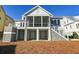 Two-story home with a large screened porch and detached garage at 1467 Jeremy Cay Ct, Awendaw, SC 29429