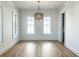 Formal dining room with hardwood floors, wainscoting, and chandelier at 1467 Jeremy Cay Ct, Awendaw, SC 29429
