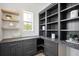 Spacious pantry with dark gray cabinetry and ample shelving at 1480 Jeremy Cay Ct, Awendaw, SC 29429