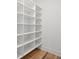 Bright white pantry with ample shelving for storage at 1480 Jeremy Cay Ct, Awendaw, SC 29429