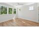 Bright bedroom with hardwood floors and large windows offering natural light at 1480 Jeremy Cay Ct, Awendaw, SC 29429
