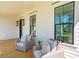 Relaxing front porch with wicker seating at 1480 Jeremy Cay Ct, Awendaw, SC 29429