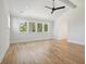 Bright bedroom featuring hardwood floors and treetop views at 1480 Jeremy Cay Ct, Awendaw, SC 29429