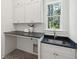 Bright laundry room with ample counter and cabinet space at 1480 Jeremy Cay Ct, Awendaw, SC 29429