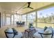 Screened porch with outdoor furniture and view of the backyard at 1480 Jeremy Cay Ct, Awendaw, SC 29429