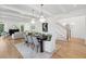 Bright dining room with hardwood floors and a large dining table at 1480 Jeremy Cay Ct, Awendaw, SC 29429