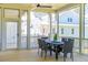 Screened porch with dining area and neighborhood views at 1480 Jeremy Cay Ct, Awendaw, SC 29429