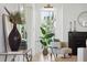 Bright living area with a fireplace, comfortable seating, and natural light from large windows at 1480 Jeremy Cay Ct, Awendaw, SC 29429