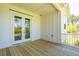 Covered deck with French doors leading to the backyard at 1480 Jeremy Cay Ct, Awendaw, SC 29429