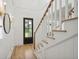 Light-filled entryway, hardwood floors, white walls, and a view of the backyard at 1480 Jeremy Cay Ct, Awendaw, SC 29429