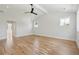 Spacious bedroom with light hardwood floors and a ceiling fan at 1480 Jeremy Cay Ct, Awendaw, SC 29429